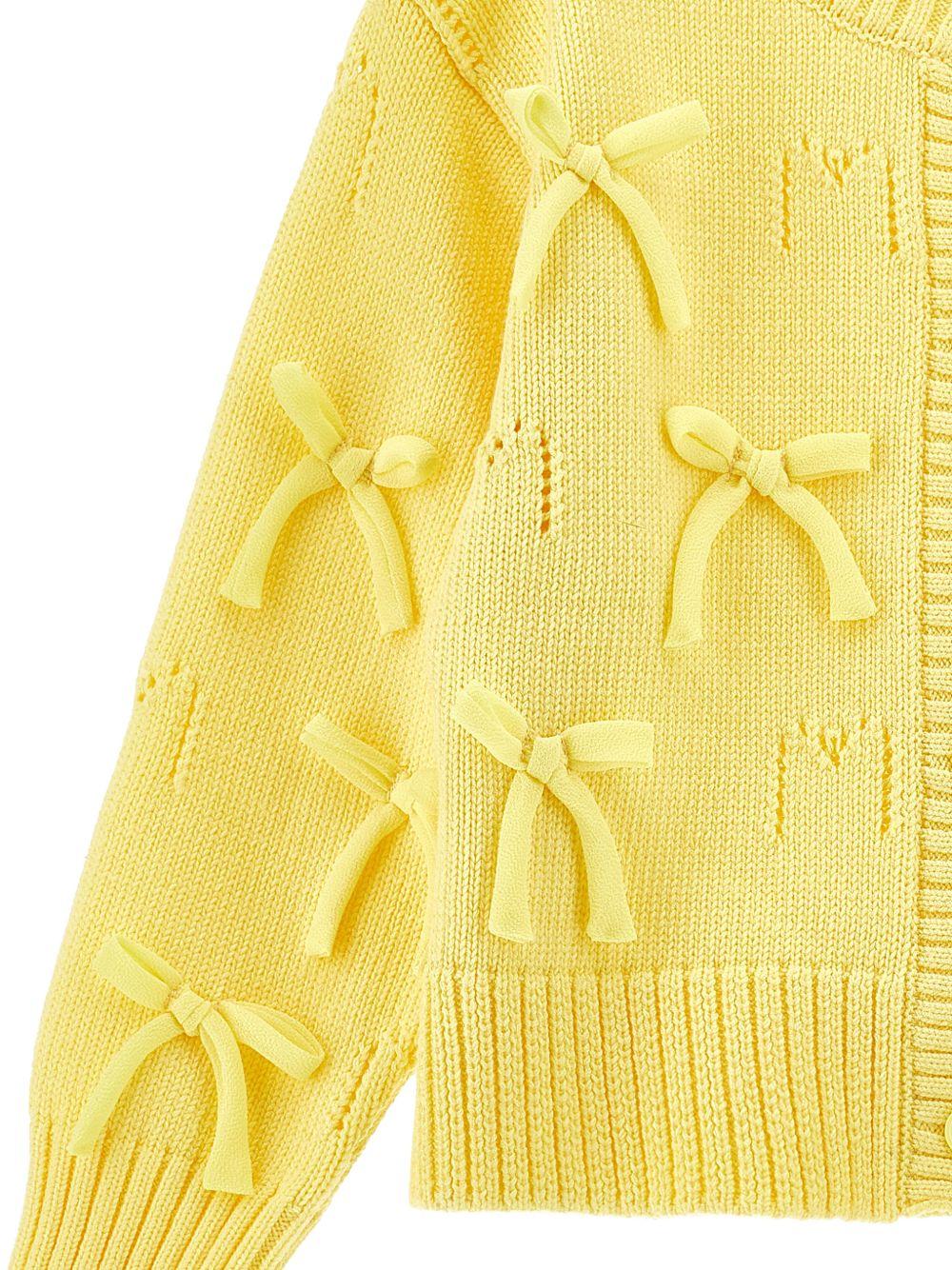 Cardigan per bambina Monnalisa giallo con dettagli fiocchi - Rubino Kids