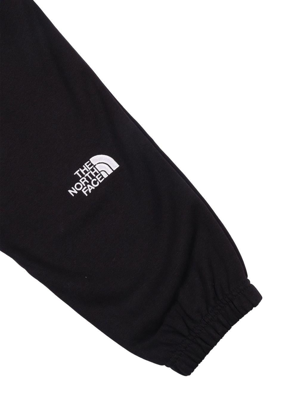 Pantaloni sportivi per bambino The North Face Kids neri con logo sul davanti NF0A8GR6 JK31 THE NORTH FACE KIDS