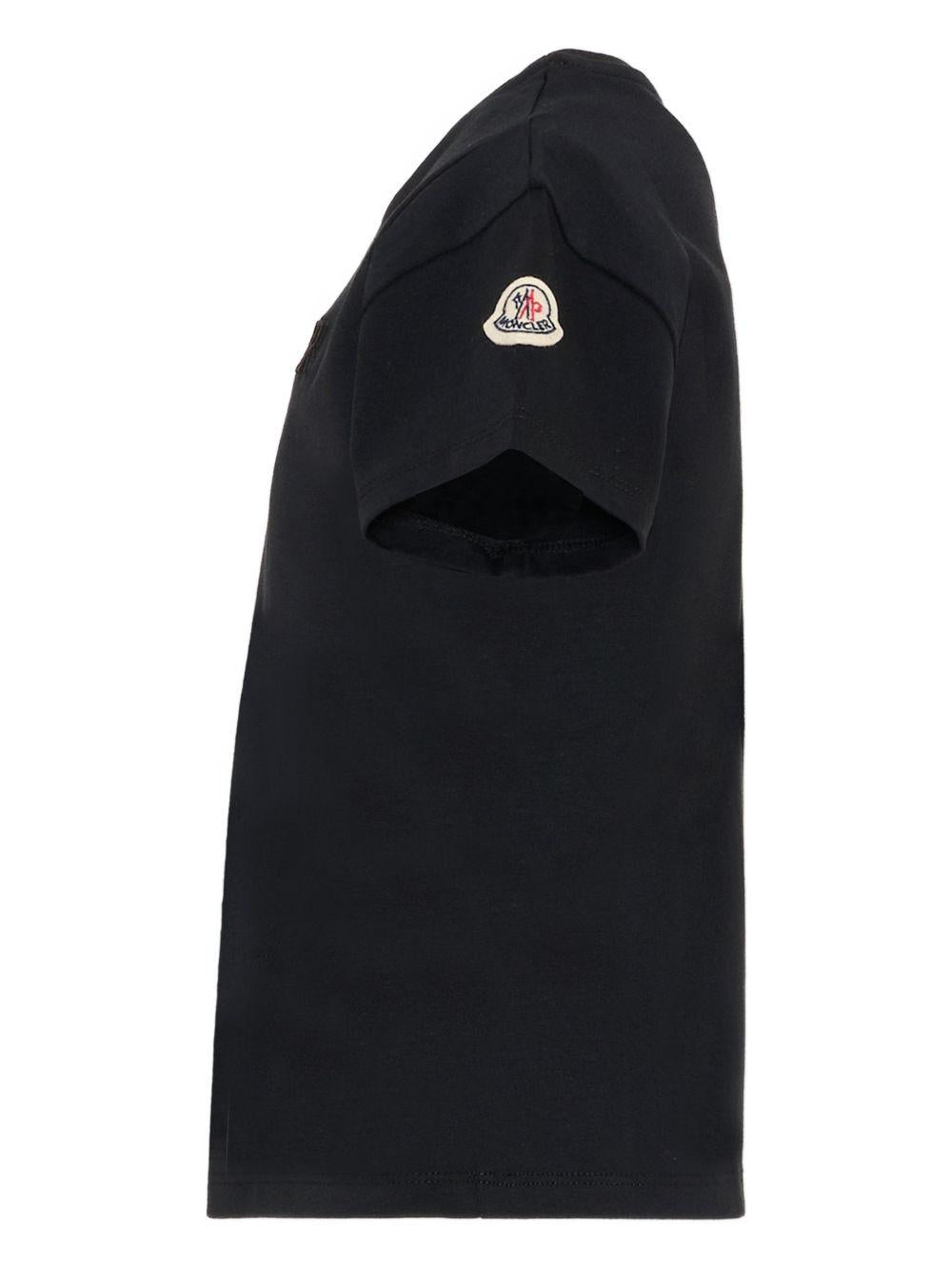 T-shirt per bambino Moncler Enfant nera con logo goffrato L19548C0000989AT9 999 MONCLER ENFANT