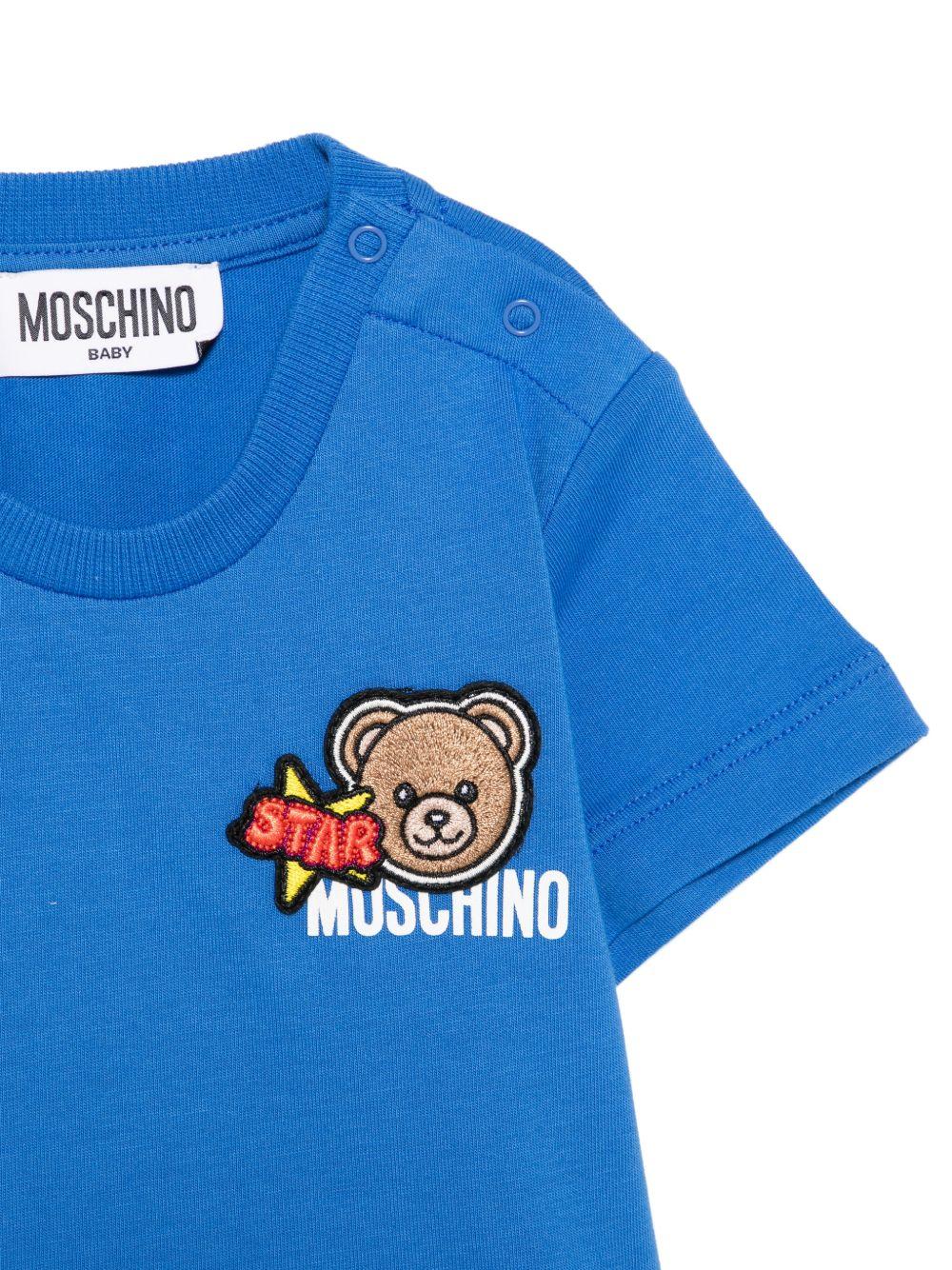 T-shirt per neonato Moschino Kids azzurra con dettagli in rilievo MVM047LAA24 40630 MOSCHINO KIDS