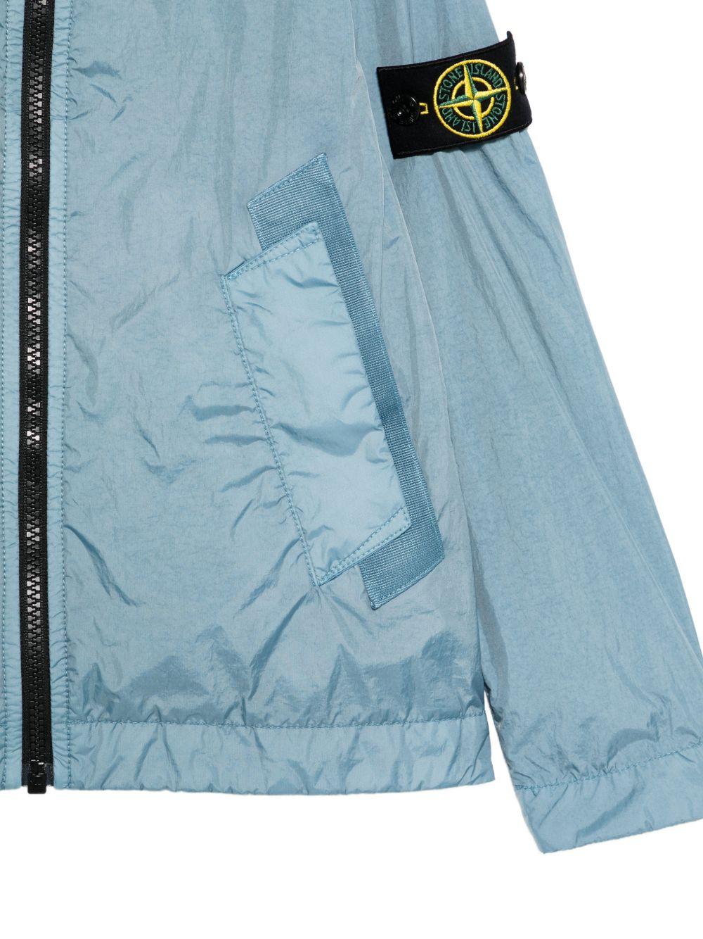 Giacca per bambino Stone Island Junior azzurro con cappuccio L1S164100003S0A23 V004A STONE ISLAND JUNIOR