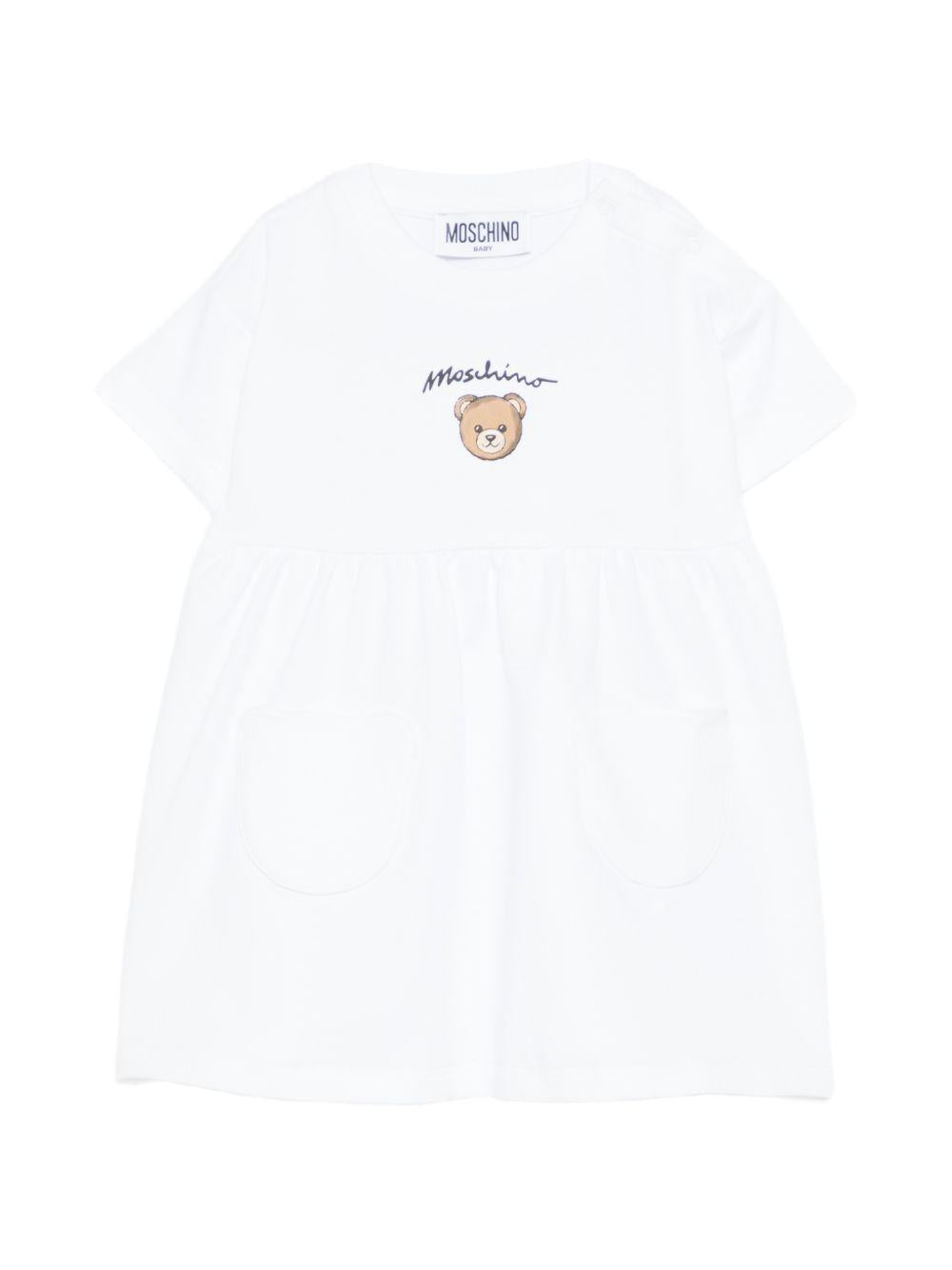 Abito per neonata Moschino Kids bianco con dettaglio orsetto MDV0DGLCA19 10101 MOSCHINO KIDS