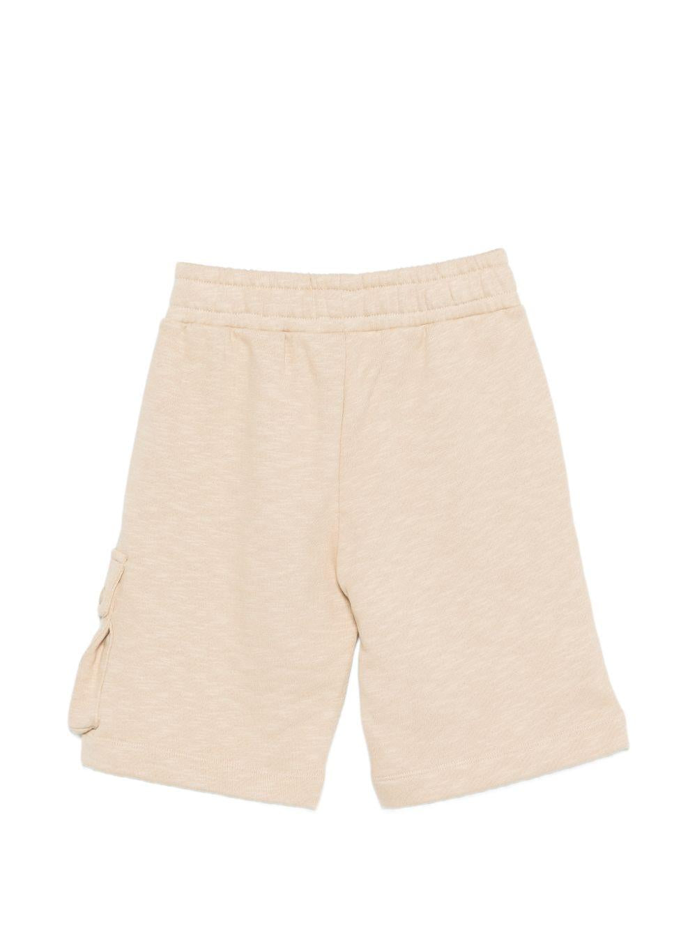 Shorts per bambino Moschino Kids beige con logo sul davanti HUQ02QLCA88 20829 MOSCHINO KIDS