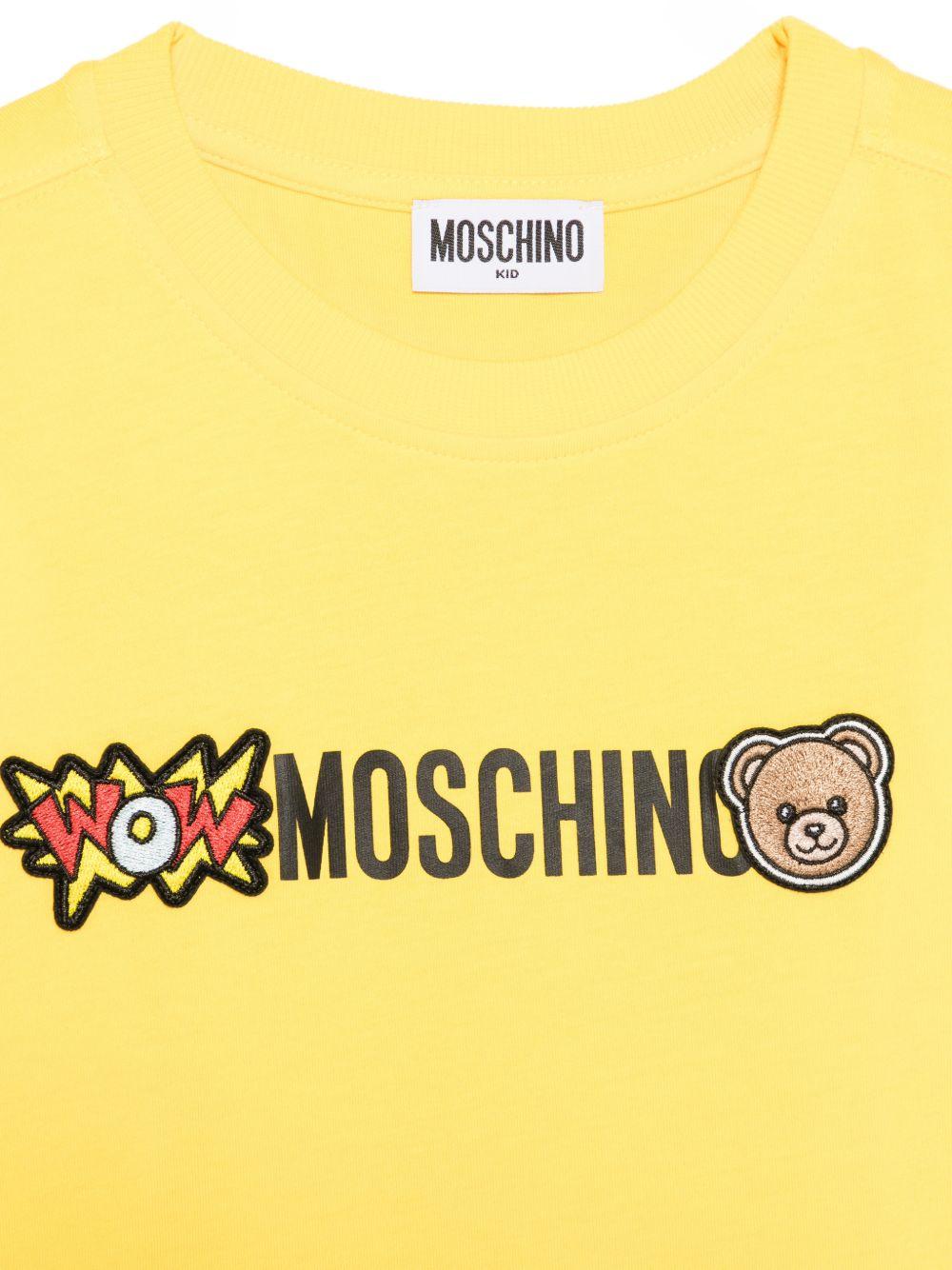 T-shirt per bambini Moschino Kids gialla con logo sul davanti HUM05QLAA24 50577 MOSCHINO KIDS