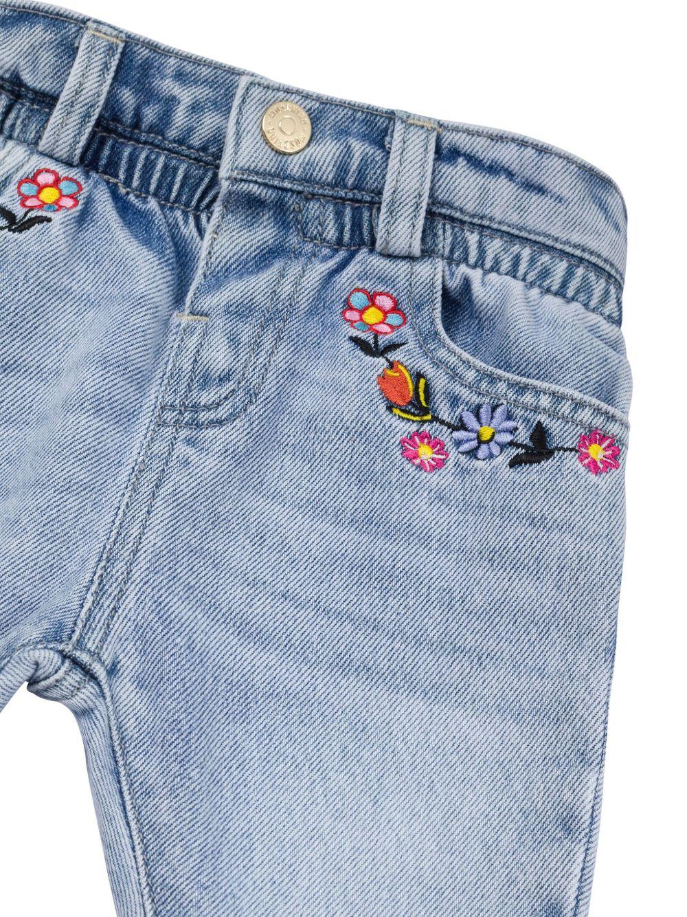 Jeans con ricamo a fiori per neonarto Moschino Kids azzurro con passanti - Rubino Kids