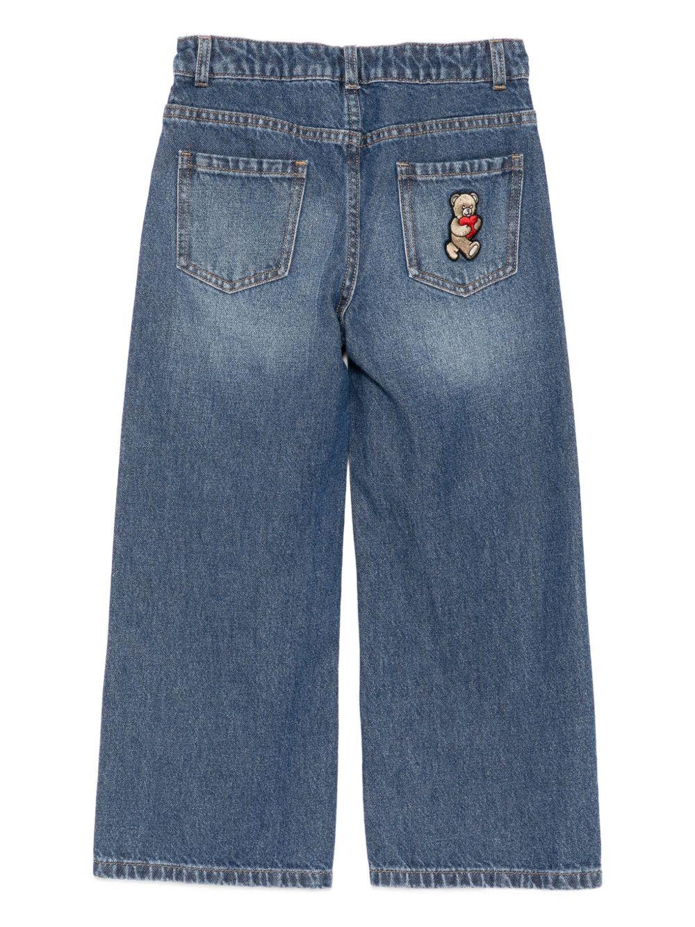 Jeans per bambina Moschino Kids denim con logo ricamato sul davanti - Rubino Kids