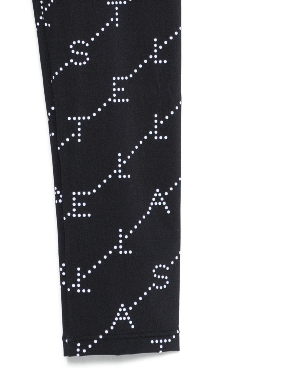 Leggins per bambina Stella McCartney Kids neri con stampa logo all - over - Rubino Kids