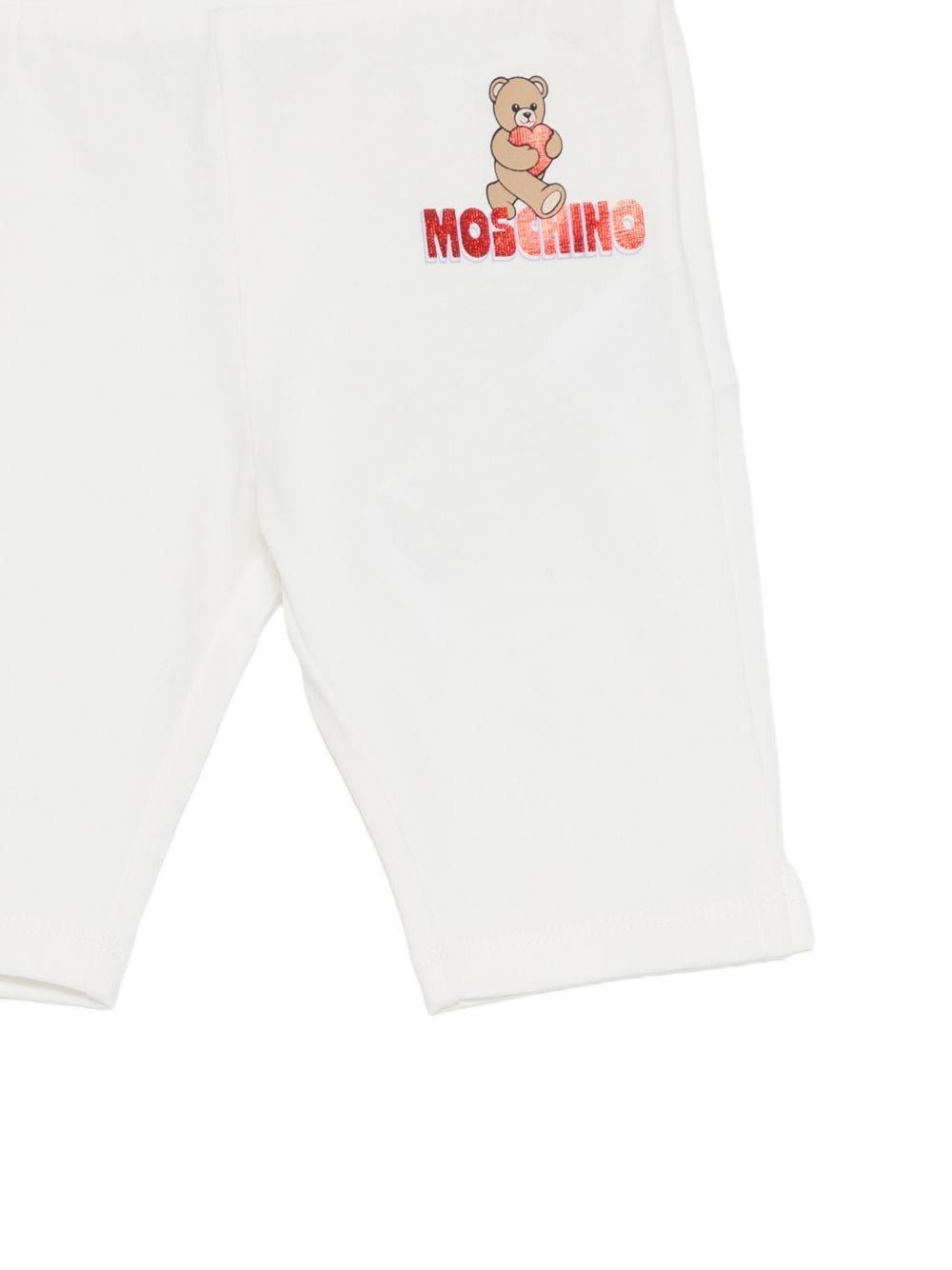 Leggins per neonata Moschino Kids bianchi con logo sul davanti - Rubino Kids