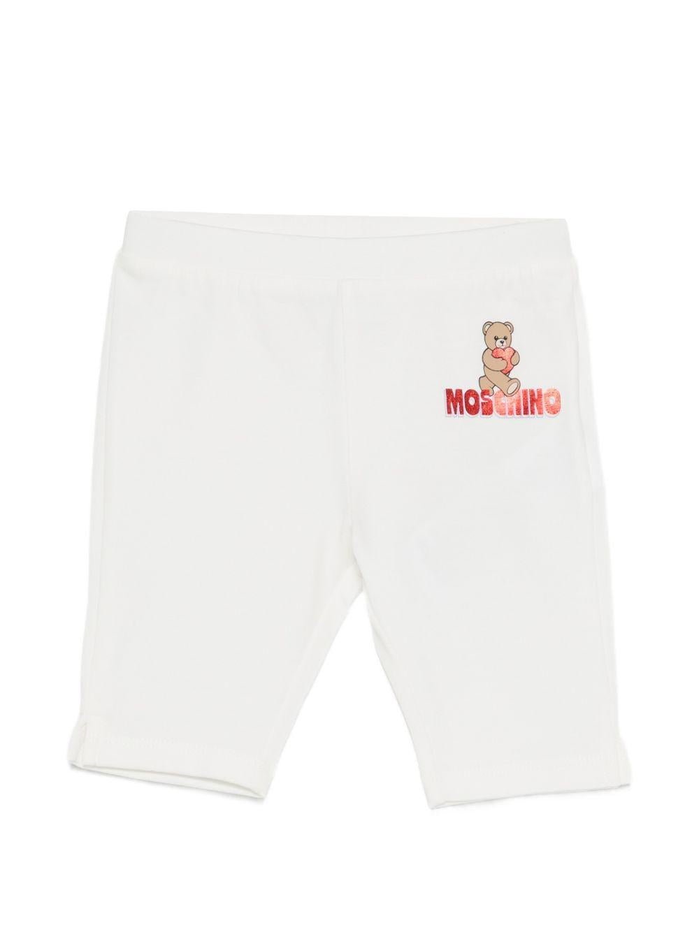 Leggins per neonata Moschino Kids bianchi con logo sul davanti - Rubino Kids