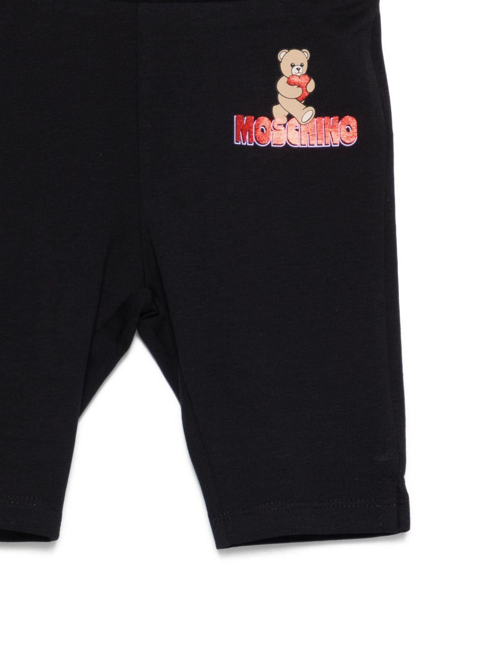 Leggins per neonata Moschino Kids neri con logo sul davanti - Rubino Kids