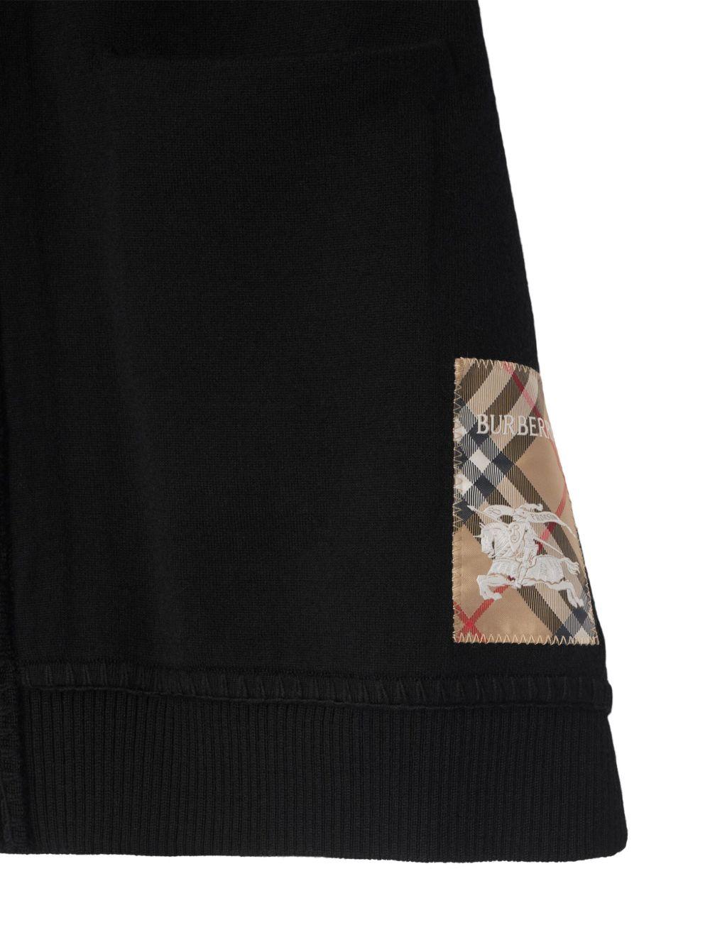 Mantella per bambina Burberry Kids nero a quadri con applicazione logo - Rubino Kids