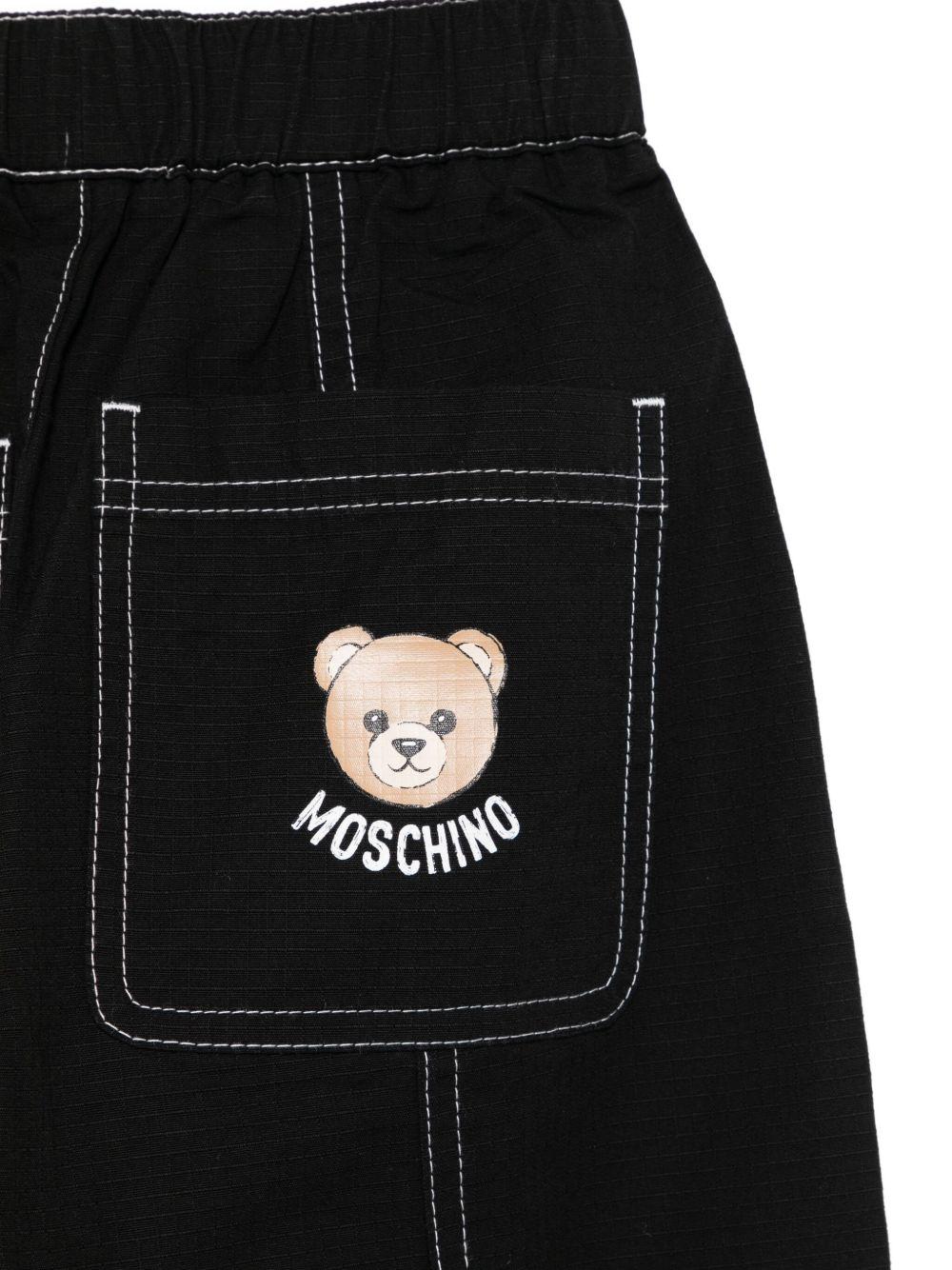 Pantaloni cargo per bambino Moschino Kids nero con cuciture a contrasto - Rubino Kids