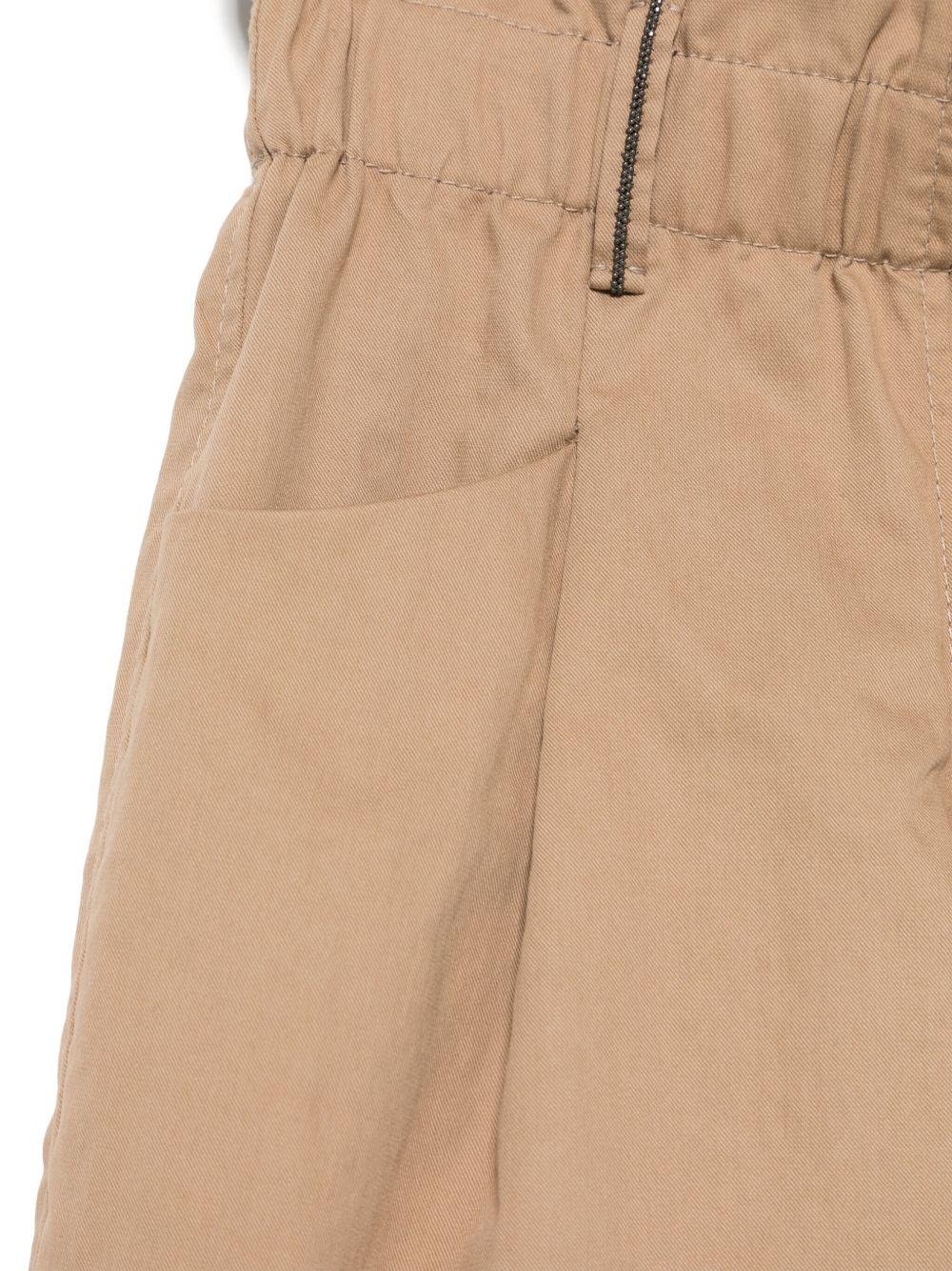 Pantaloni per bambina Brunello Cucinelli Kids beige in cotone con vita paperbag - Rubino Kids