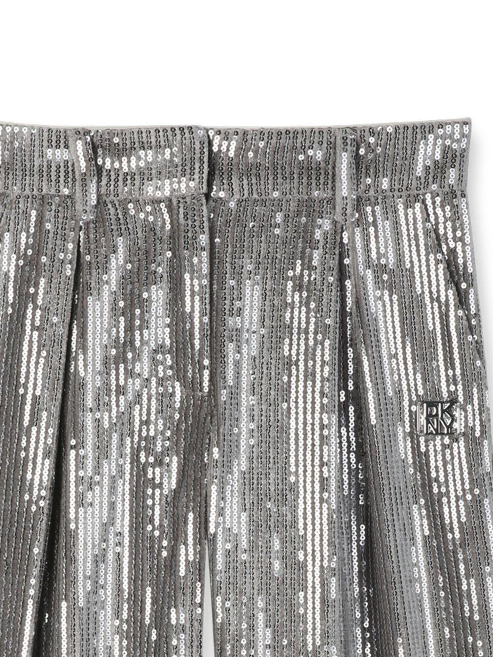 Pantaloni per bambina Dkny Kids argentati con design paillettes all - over - Rubino Kids