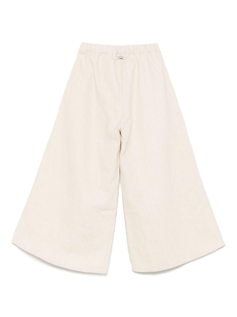 Pantaloni per bambina Donsje beige con applicazione a fiori - Rubino Kids