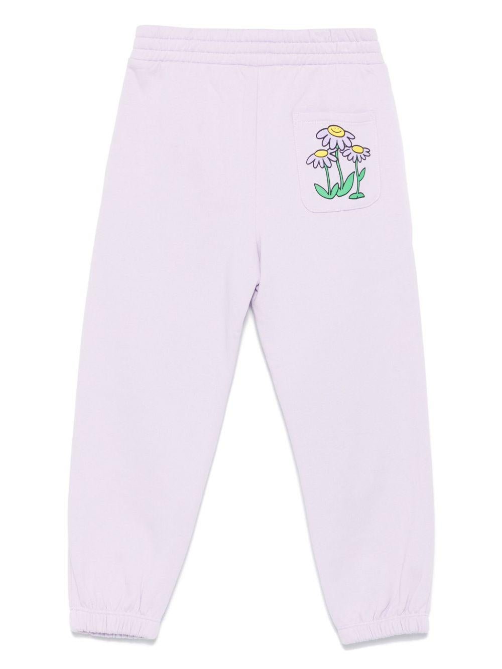 Pantaloni per bambina Stella McCartney Kids lilla con stampa margherite - Rubino Kids