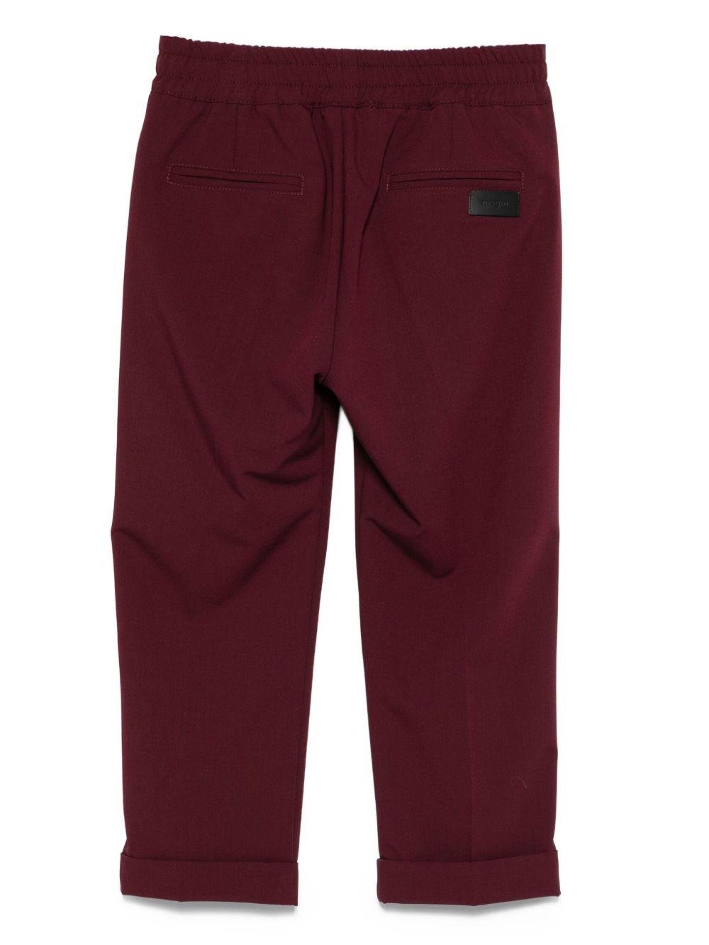 Pantaloni per bambini MSGM Kids bordeaux con elastico in vita e orli svasati - Rubino Kids