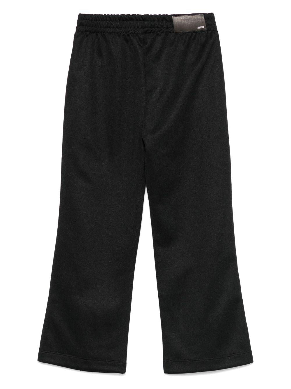 Pantaloni per bambino Amiri Kids neri con righe laterali - Rubino Kids