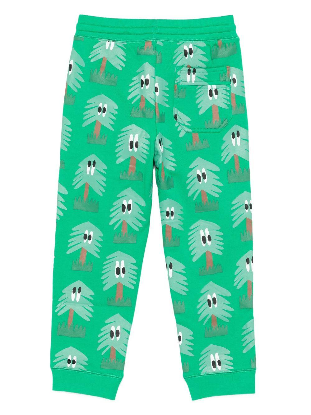 Pantaloni per bambino Stella McCartney Kids verde con stampa di alberi - Rubino Kids
