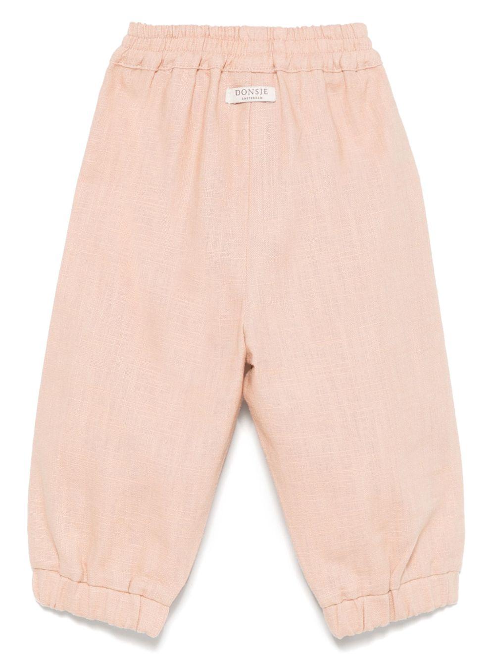 Pantaloni per neonata Donsje Anje rosa con applicazione a fiori - Rubino Kids