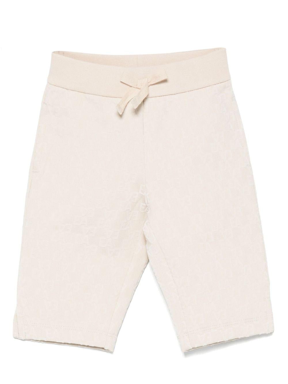 Pantaloni per neonata Emporio Armani Kids beige con motivo all - over - Rubino Kids
