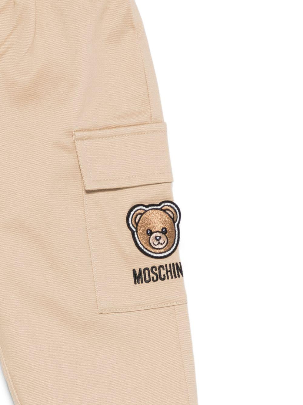 Pantaloni per neonato Moschino Kids beige con ricamo Teddy sul davanti - Rubino Kids