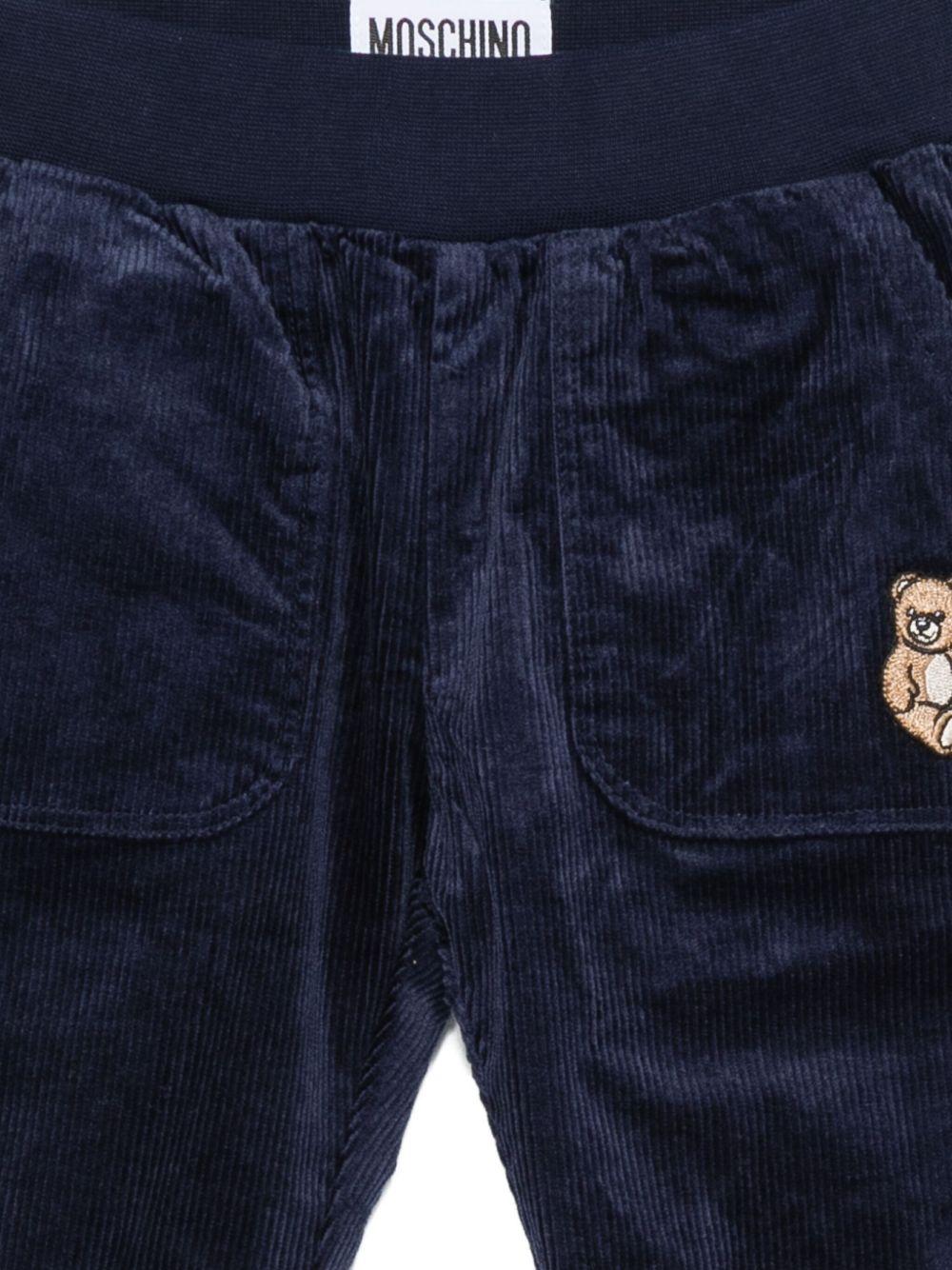 Pantaloni per neonato Moschino Kids blu di velluto a coste con ricami a forma di orsacchiotto - Rubino Kids