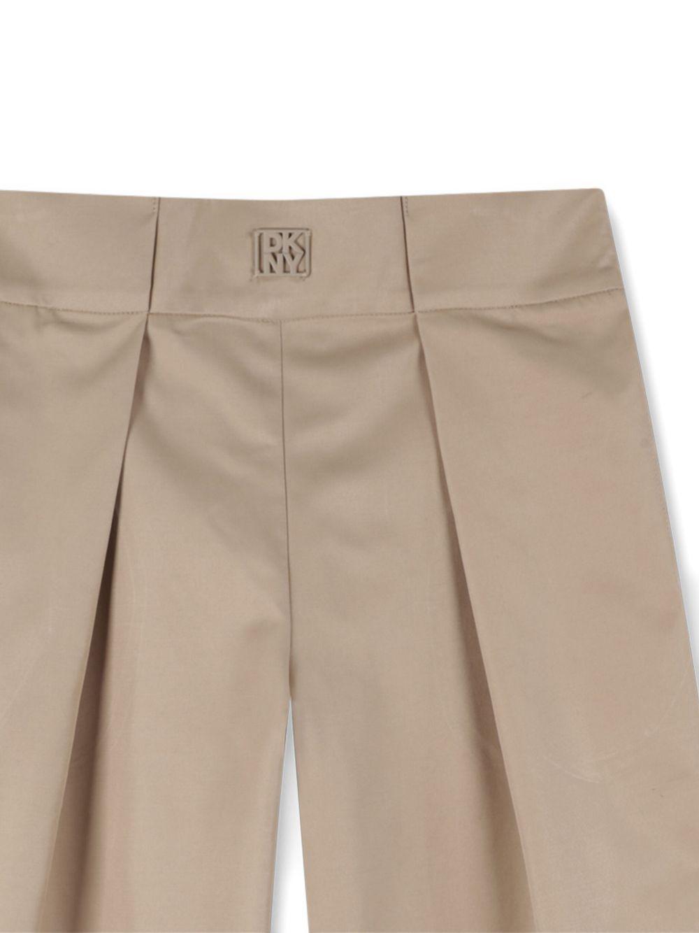 Pantaloni sartoriali per bambina DKNY Kids beige con tasche laterali - Rubino Kids