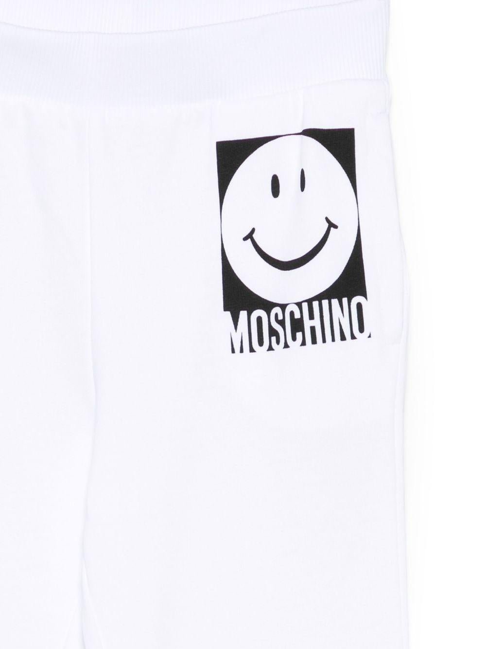 Pantaloni sportivi Moschino Kids bianco con motivo smiley - Rubino Kids