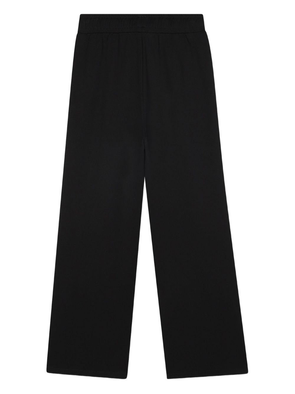 Pantaloni sportivi per bambina DKNY Kids neri con logo - Rubino Kids