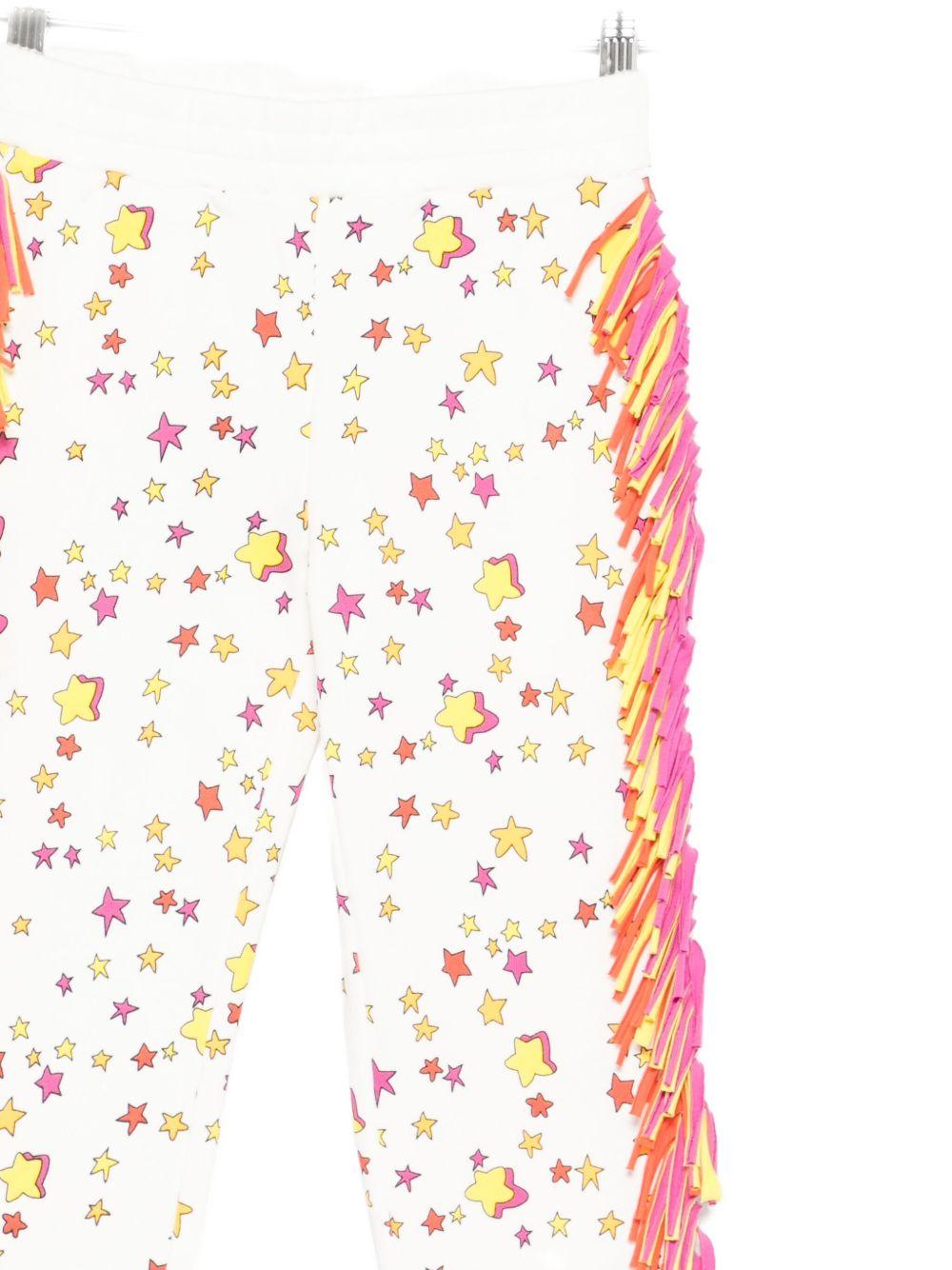 Pantaloni sportivi per bambina Stella McCartney Kids bianco con stampa stelle e frange - Rubino Kids