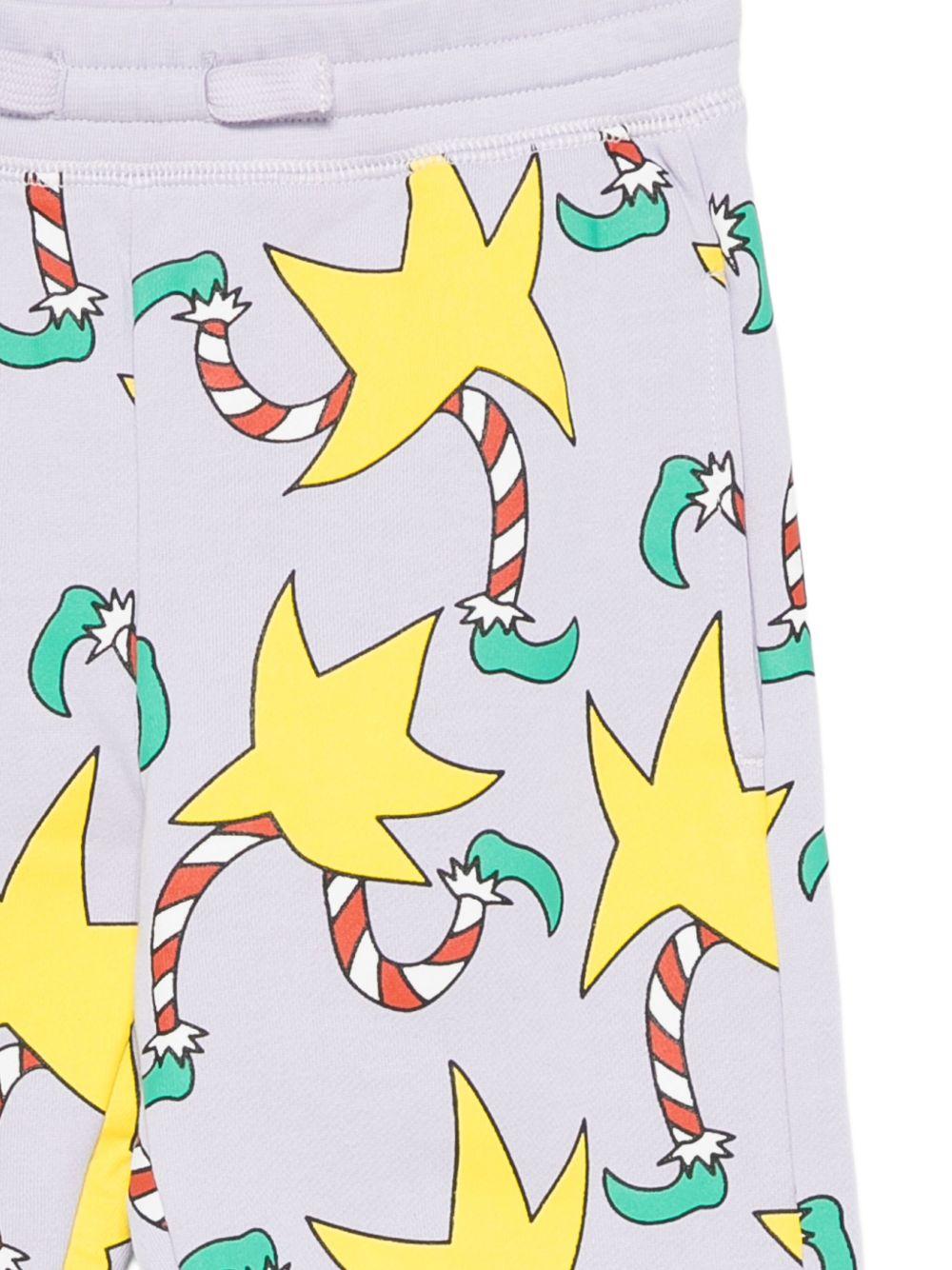 Pantaloni sportivi per bambina Stella McCartney Kids lilla con stampa stelle - Rubino Kids