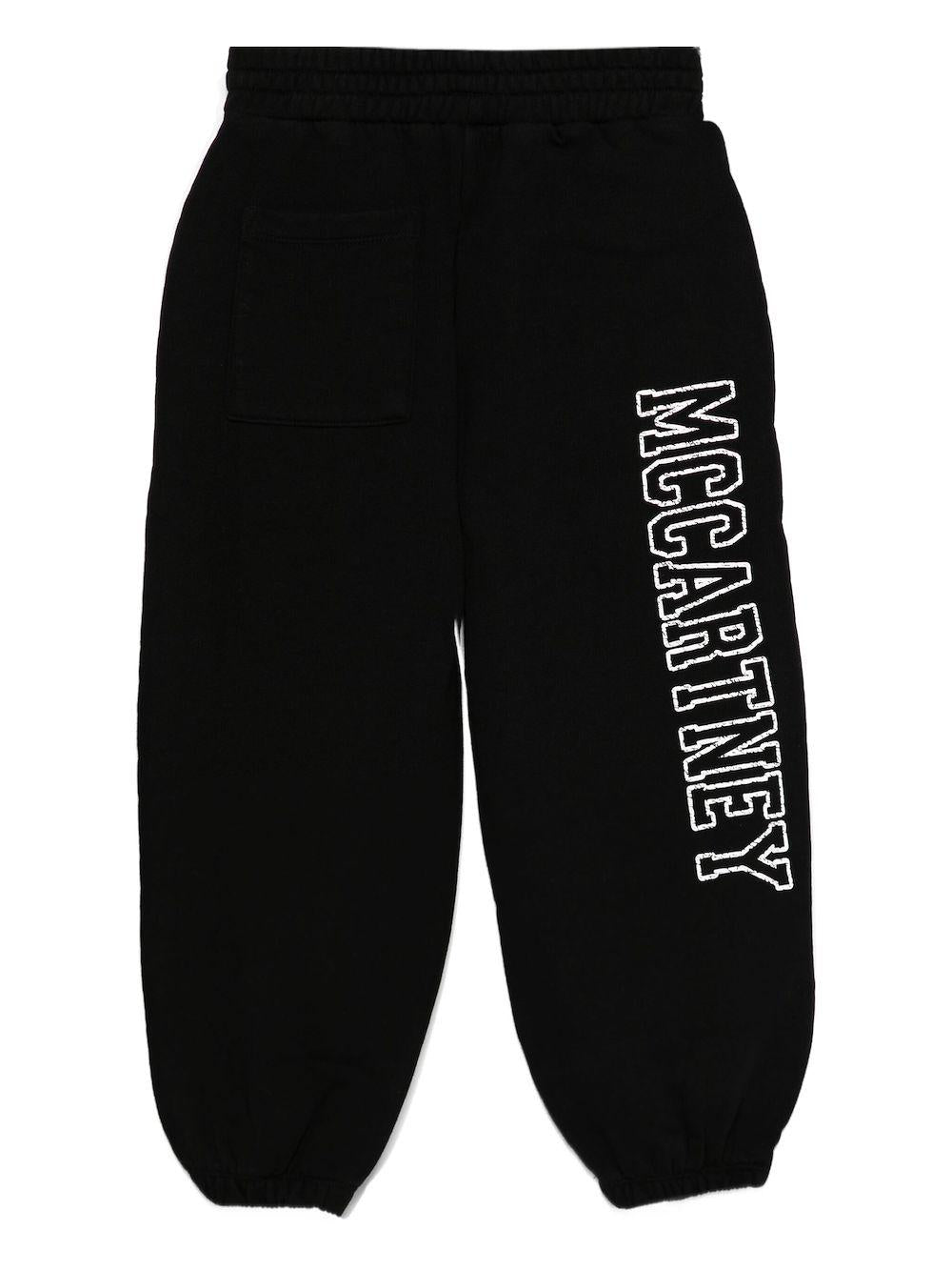 Pantaloni sportivi per bambina Stella McCartney Kids nero con stampa logo sulla gamba - Rubino Kids