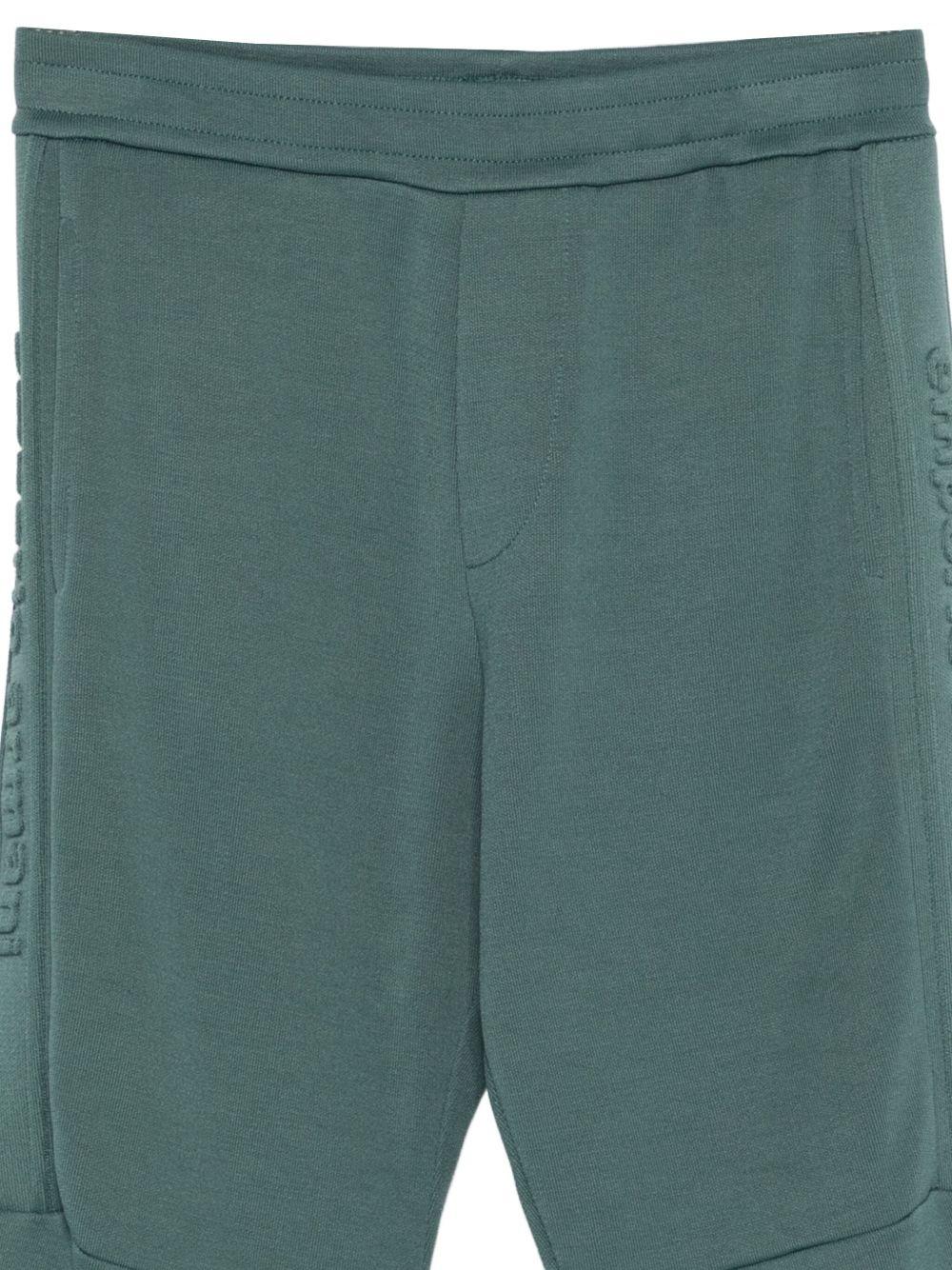 Pantaloni sportivi per bambino Emporio Armani Kids verde con logo in rilievo - Rubino Kids