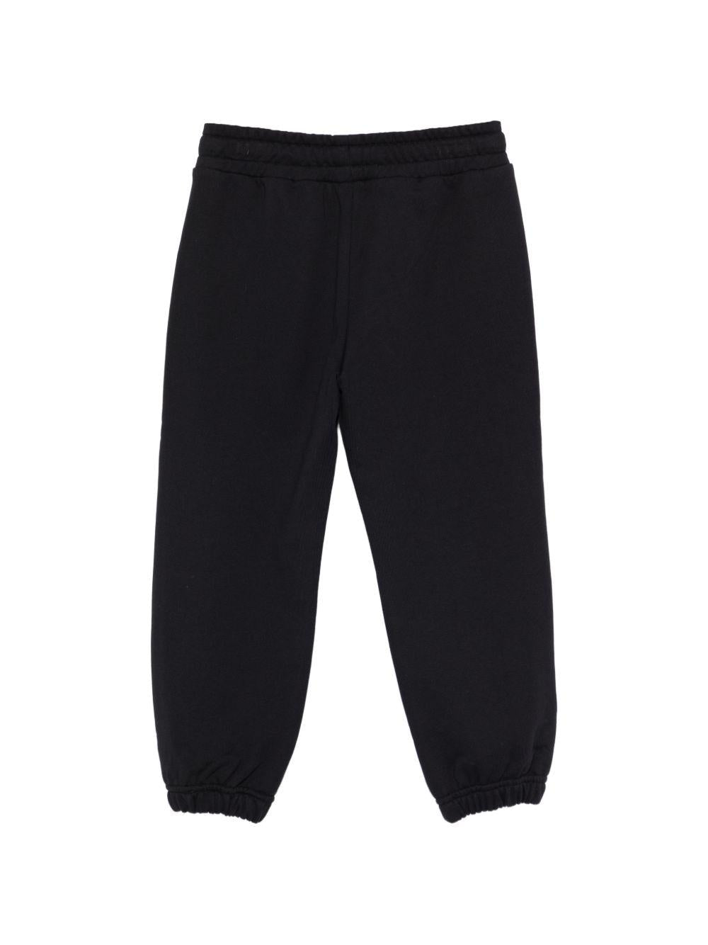 Pantaloni sportivi per bambino Moschino Kids neri con logo sul davanti - Rubino Kids