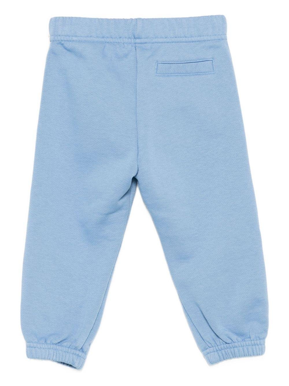 Pantaloni sportivi per bambino Palm Angels Kids azzurri con stampa con logo - Rubino Kids
