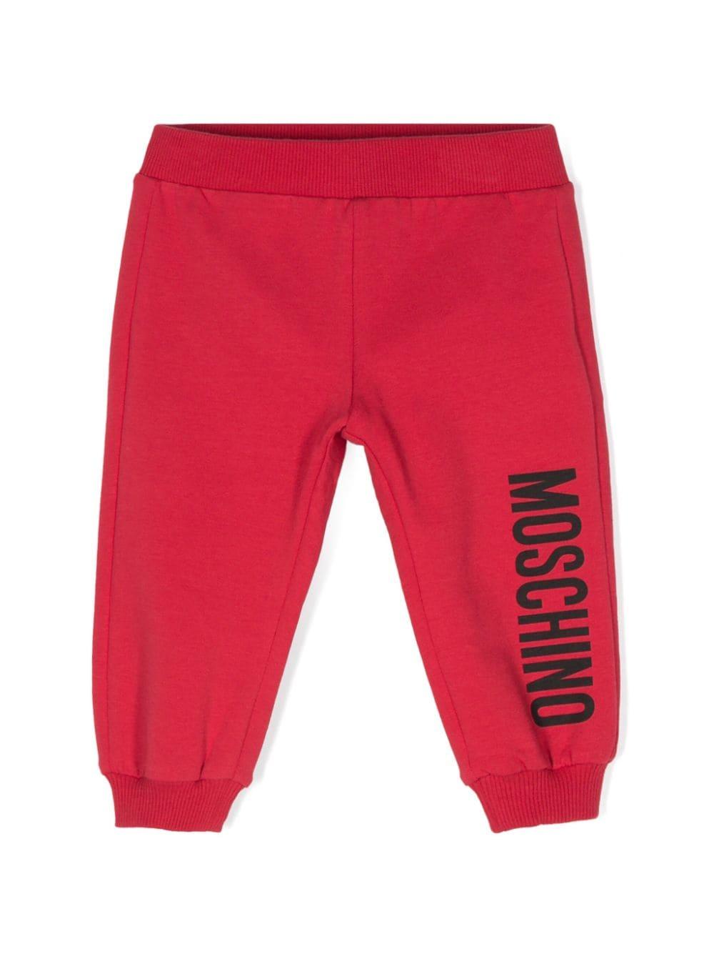 Pantaloni sportivi per neonati Moschino Kids rosso con logo sulla gamba - Rubino Kids