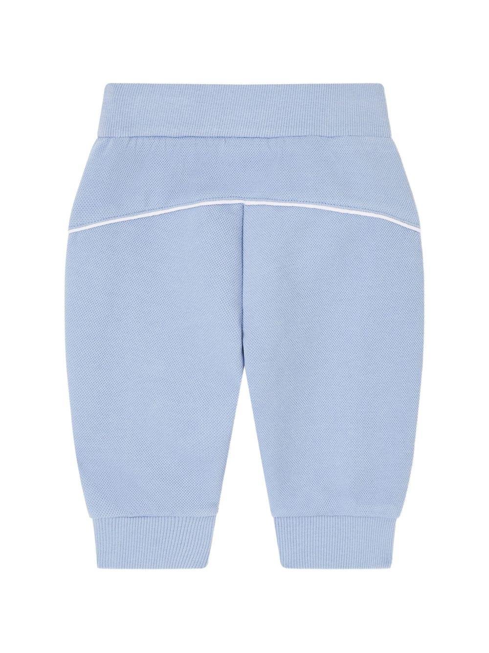 Pantaloni sportivi per neonato Emporio Armani Kids azzurro con logo aquila sul davanti - Rubino Kids