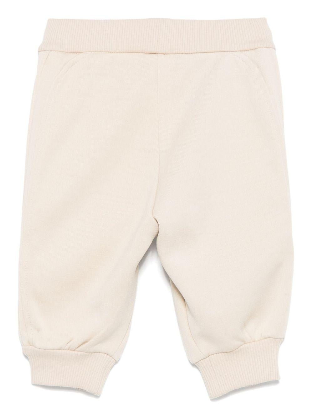 Pantaloni sportivi per neonato Emporio Armani Kids bige con dettagli con logo - Rubino Kids