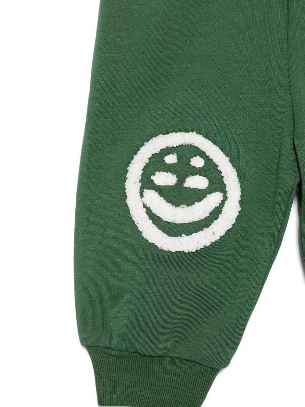Pantaloni sportivi per neonato Molo verdi con faccina sorridente - Rubino Kids