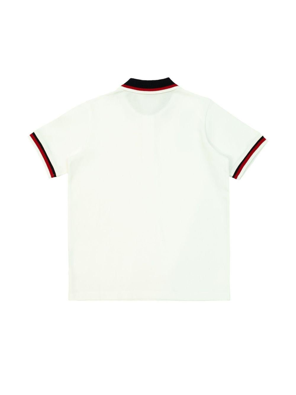 Polo con applicazione logo per bambino Moncler Enfant bianco con abbottonatura frontale corta - Rubino Kids