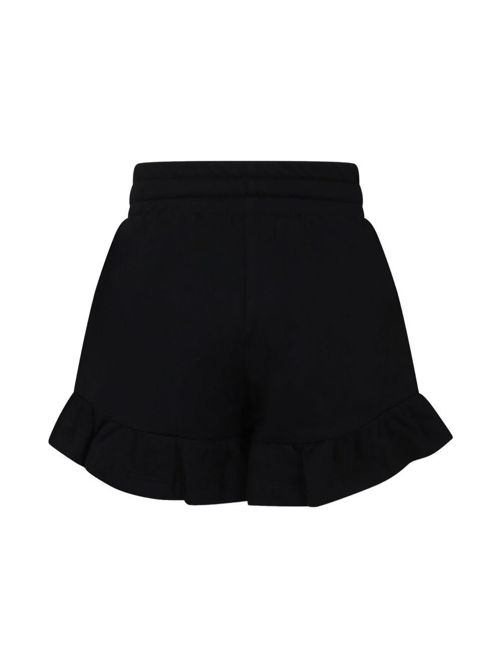 Shorts con motivo Teddy Bear per bambina Moschino Kids nero con logo sulla gamba - Rubino Kids