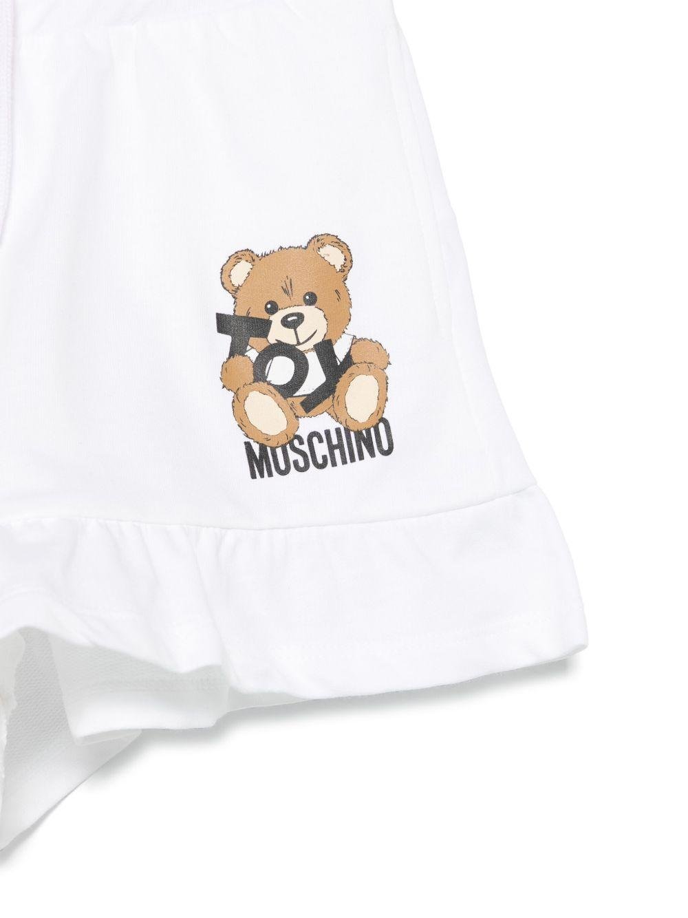 Shorts con stampa Leo Teddy per bambina Moschino Kids bianco con due tasche laterali - Rubino Kids