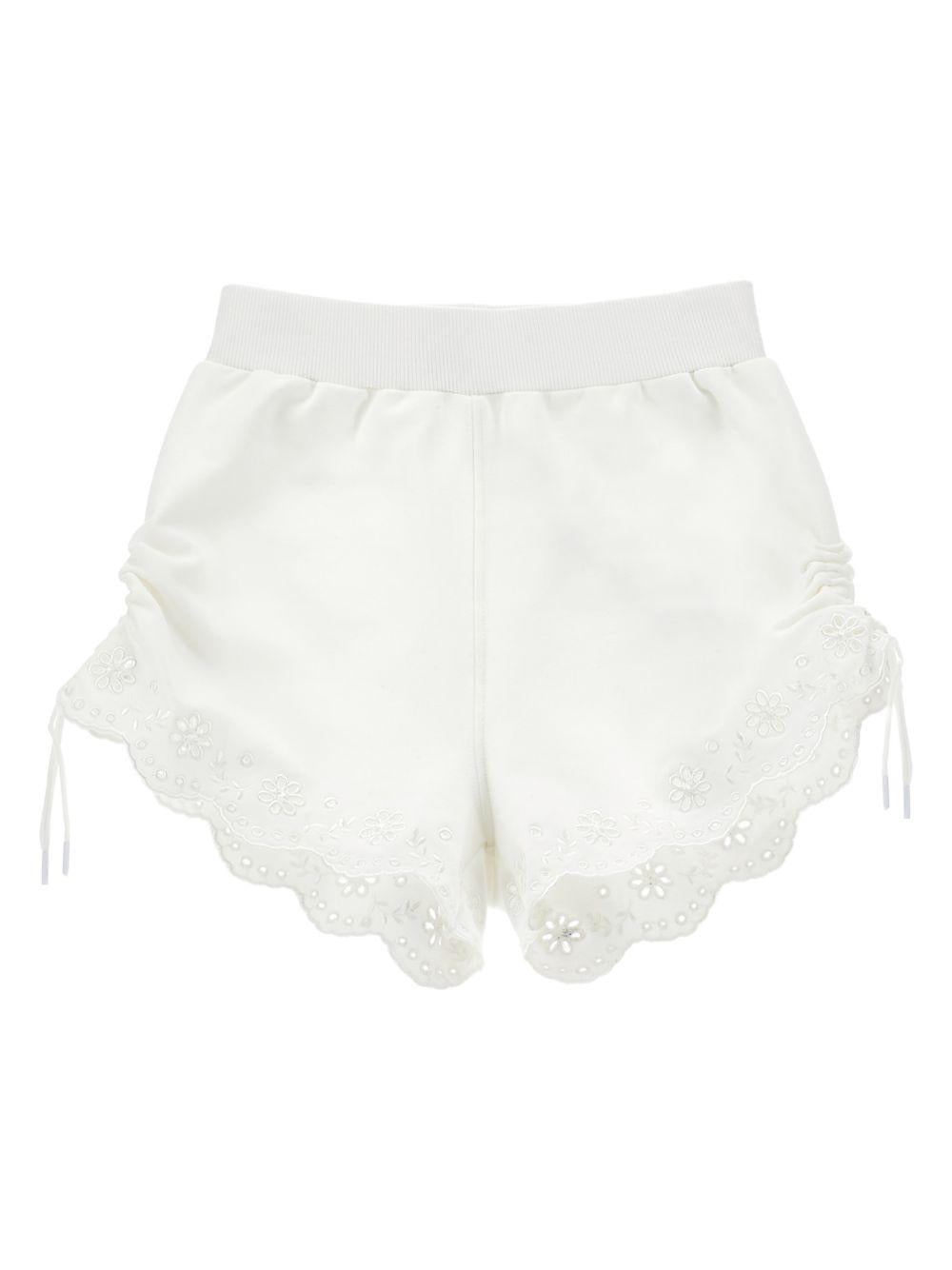 Shorts per bambina Monnalisa bianchi con ricamo a fiori - Rubino Kids
