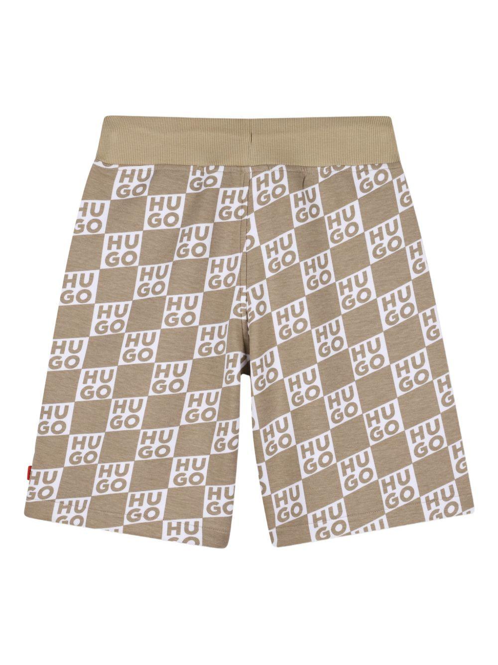 Shorts per bambino Hugo Kids beige con stampa logo all - over - Rubino Kids