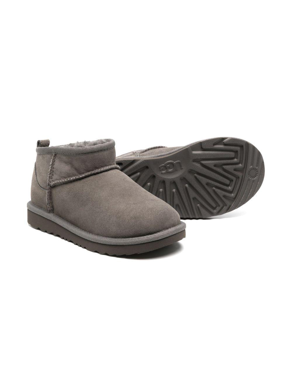 Stivali Ultra Mini per bambina UGG Kids grigi con design slip - on - Rubino Kids