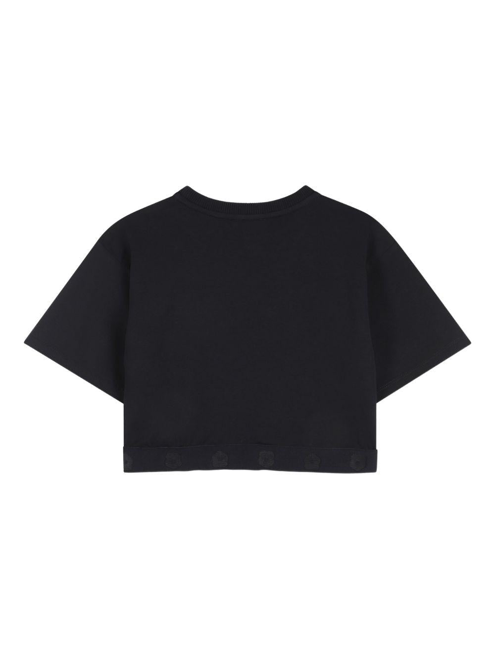 T-shirt per bambina Kenzo Kids nera con dettaglio fiore - Rubino Kids