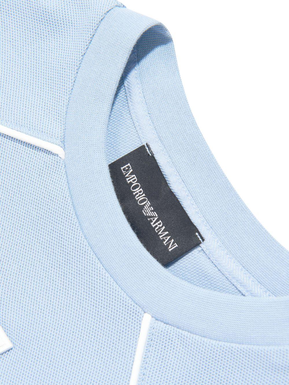 T-shirt per bambino Emporio Armani Kids azzurra con toppa con logo sul davanti - Rubino Kids