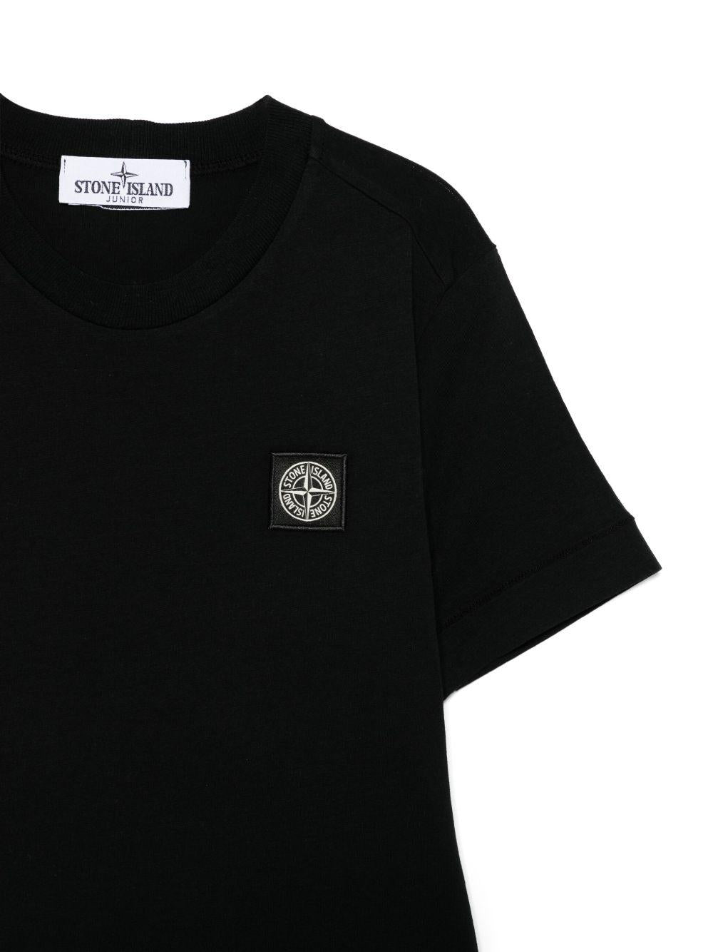 T-shirt per bambino Stone Island Junior nero con applicazione Compass - Rubino Kids