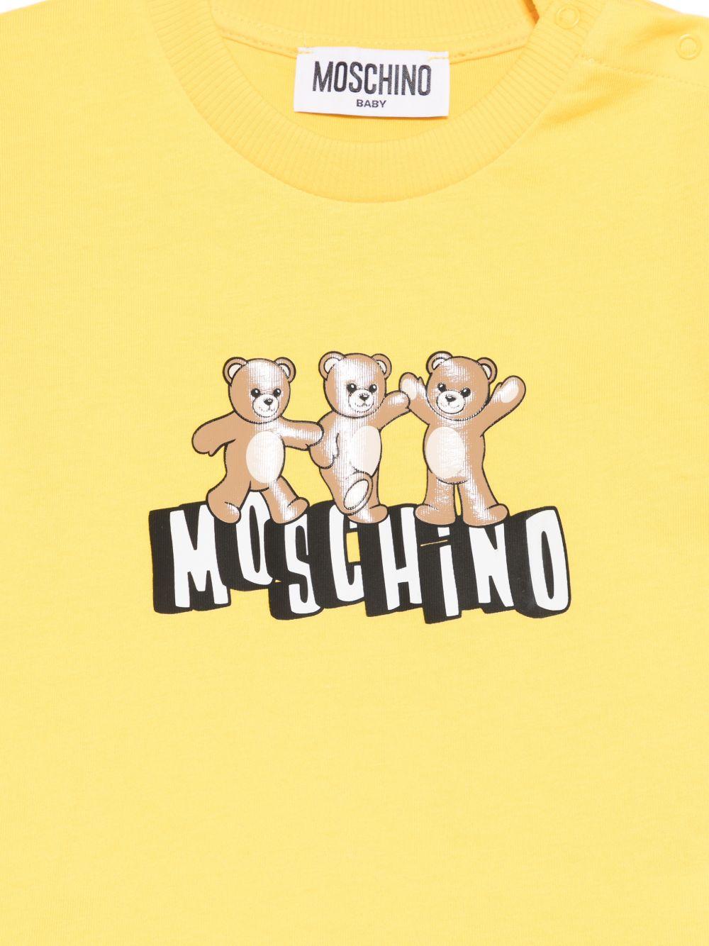 T-shirt per neonati Moschino Kids gialla con stampa grafica con tre Teddy Bear - Rubino Kids